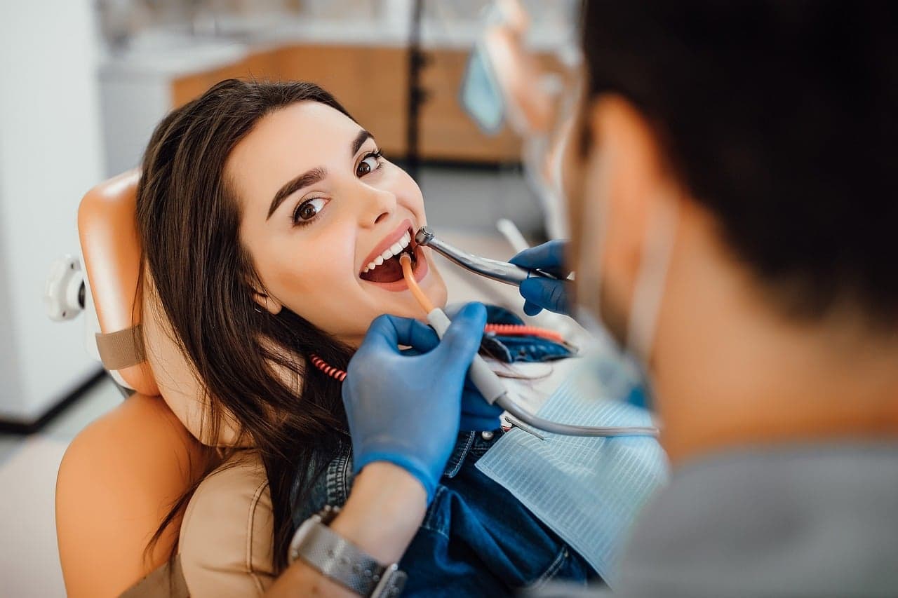 A smiling patient in the dental chair