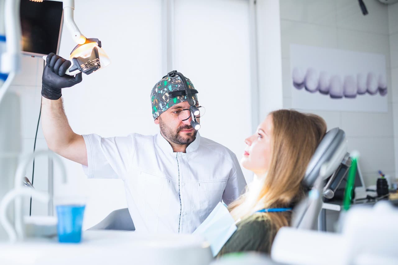 A dentist and patient talking before treatment